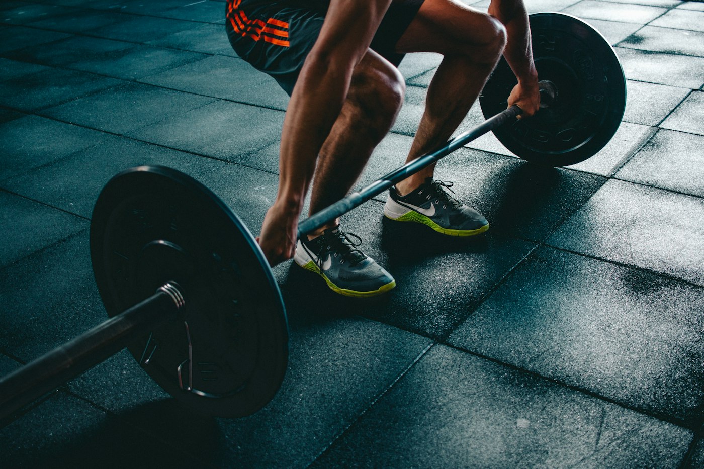 A lifter setting up with a barbell